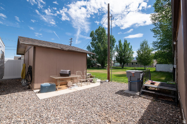 855 East 300 N Street Beaver, UT 84713 - Photo 15 of 44 Detached storage shed featuring a pitched roof and siding exterior
