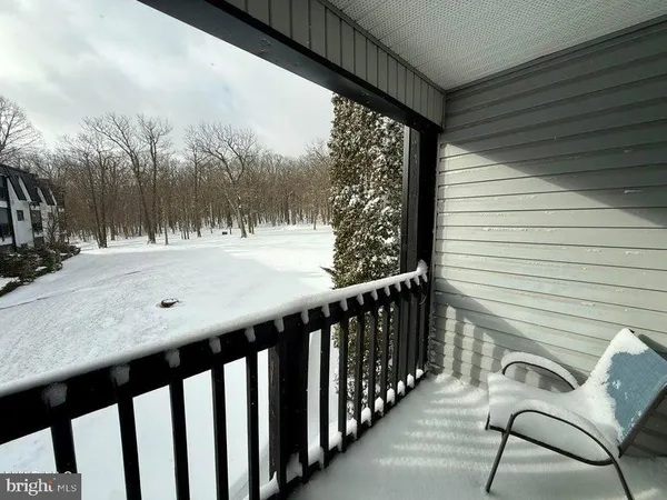 a view of a porch with furniture