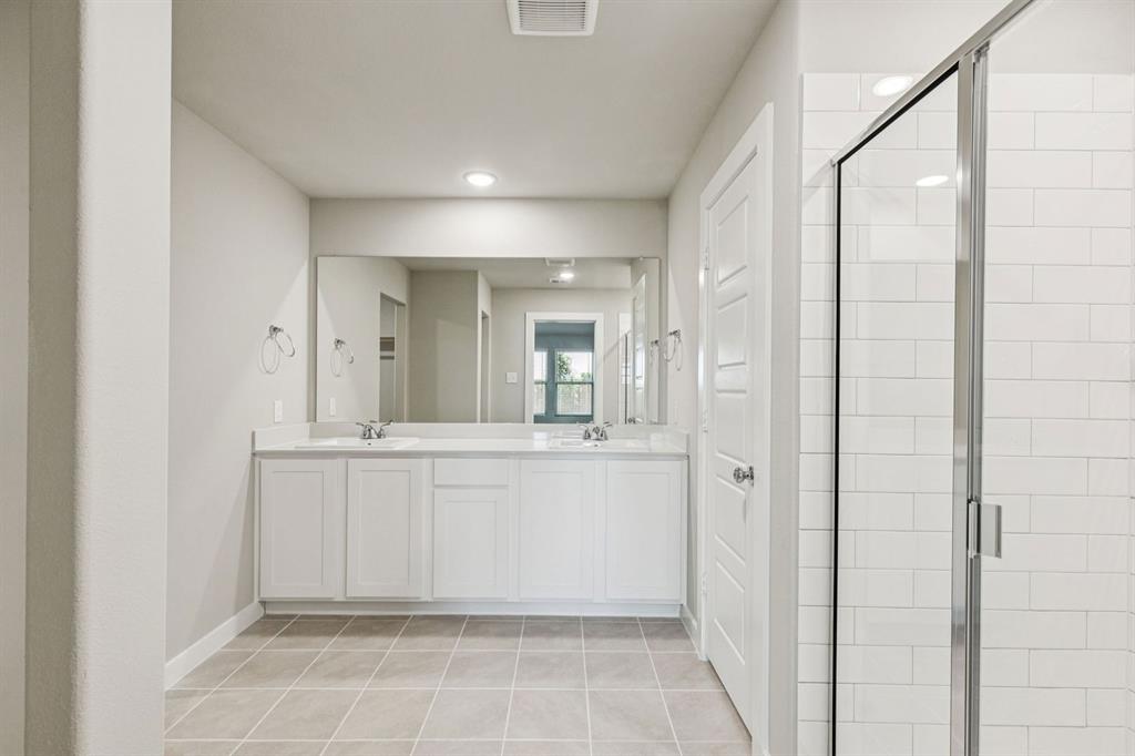 1184 Nora Lane Forney, TX 75126 - Photo 16 of 27 Primary Bathroom in the Harper home plan by Trophy Signature Homes – REPRESENTATIVE PHOTO