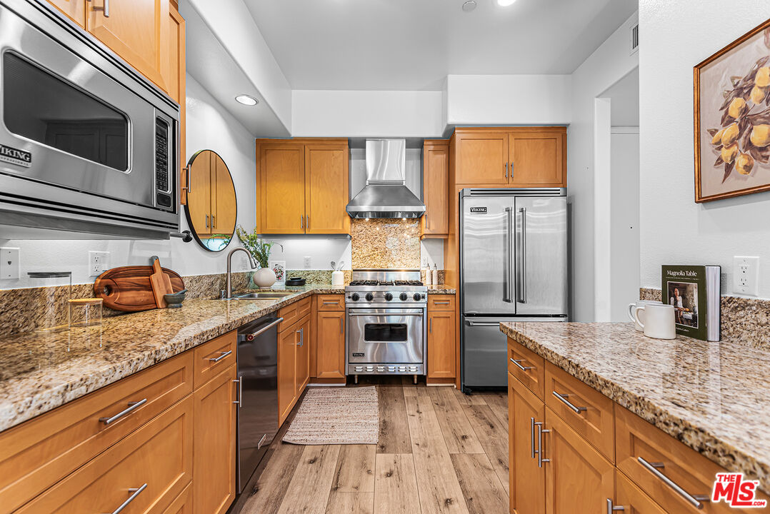 4050 Glencoe Avenue, Unit 414 Marina del Rey, CA 90292 - Photo 12 of 31 a kitchen with stainless steel appliances granite countertop a stove and a sink