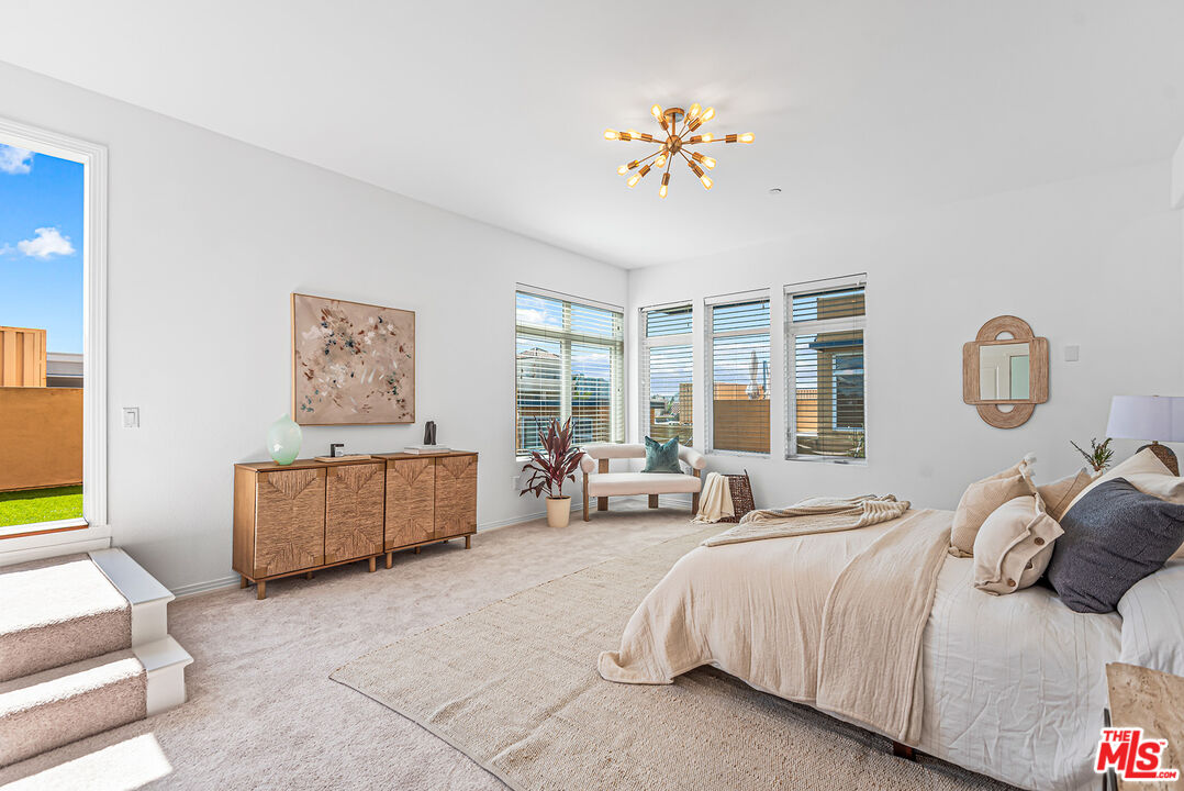 4050 Glencoe Avenue, Unit 414 Marina del Rey, CA 90292 - Photo 16 of 31 a spacious bedroom with a bed and a large window
