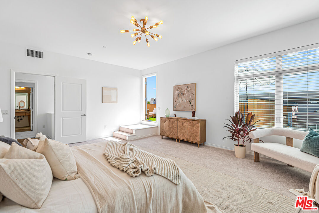 4050 Glencoe Avenue, Unit 414 Marina del Rey, CA 90292 - Photo 17 of 31 a bedroom with furniture and a large window
