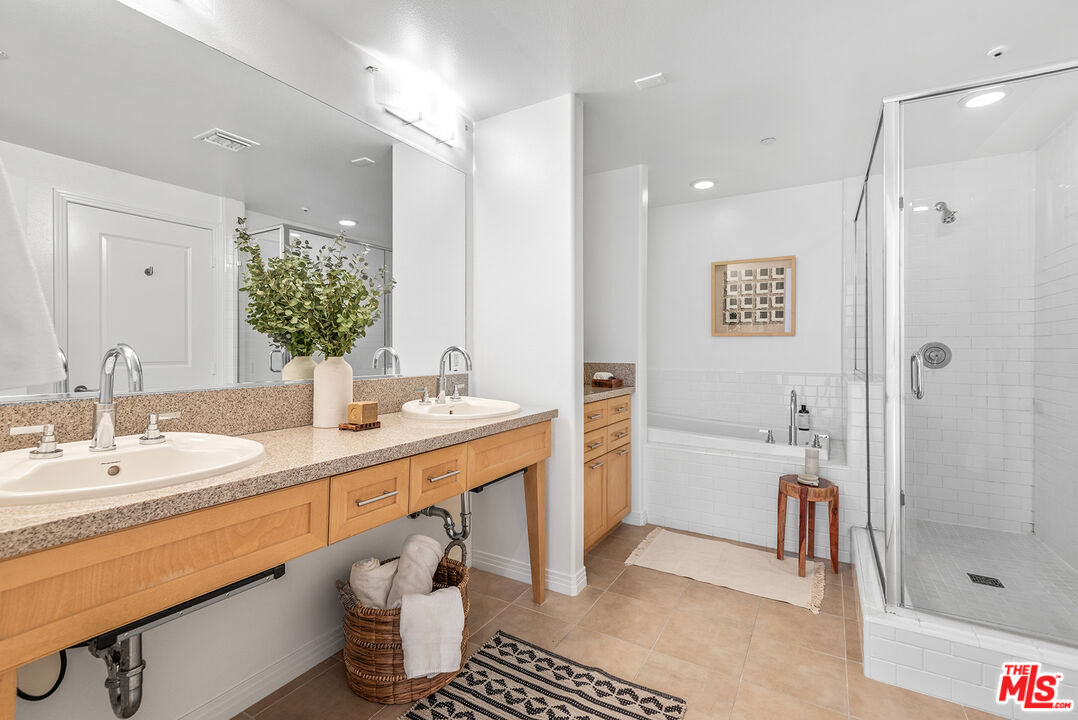4050 Glencoe Avenue, Unit 414 Marina del Rey, CA 90292 - Photo 18 of 31 a bathroom with a sink a toilet and shower