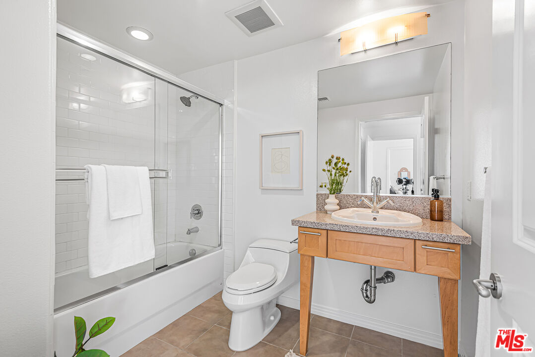 4050 Glencoe Avenue, Unit 414 Marina del Rey, CA 90292 - Photo 20 of 31 a bathroom with a sink a toilet and shower