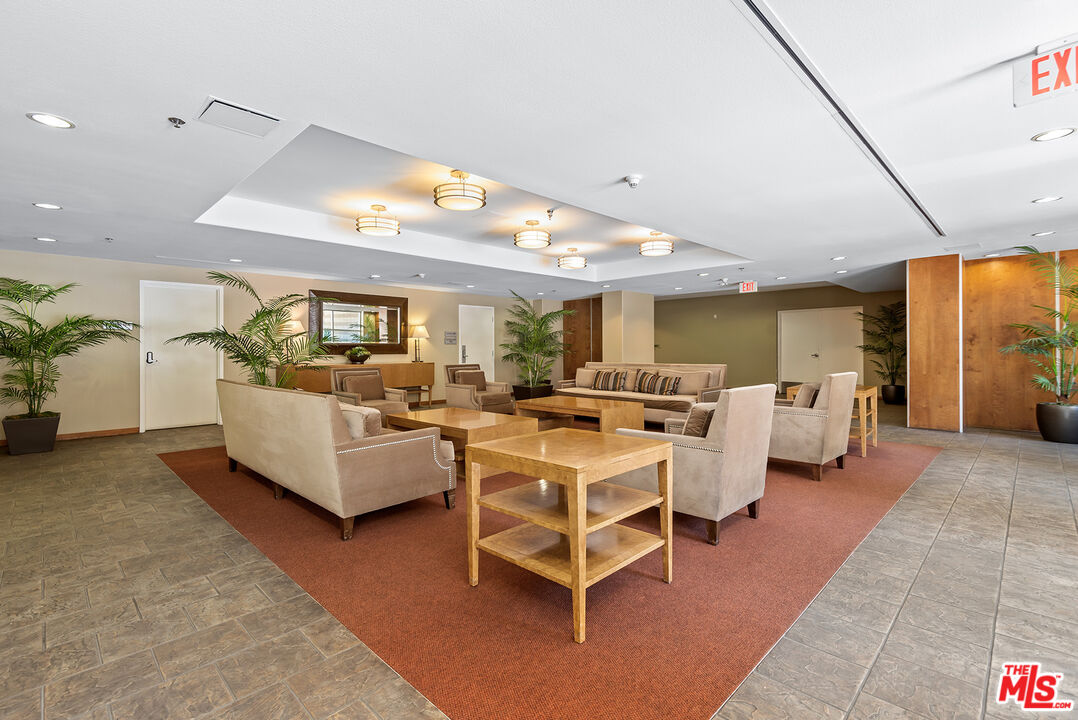 4050 Glencoe Avenue, Unit 414 Marina del Rey, CA 90292 - Photo 25 of 31 a living room with furniture and a large window