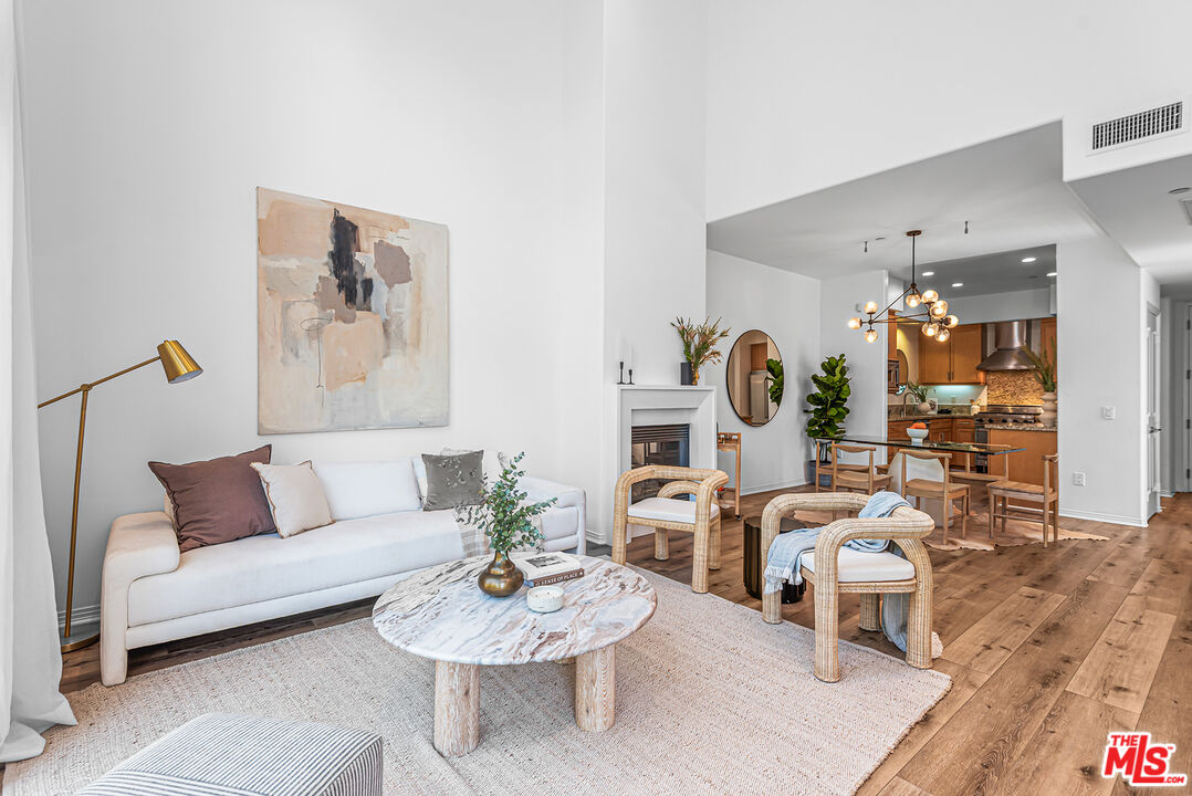 4050 Glencoe Avenue, Unit 414 Marina del Rey, CA 90292 - Photo 7 of 31 a living room with furniture and wooden floor