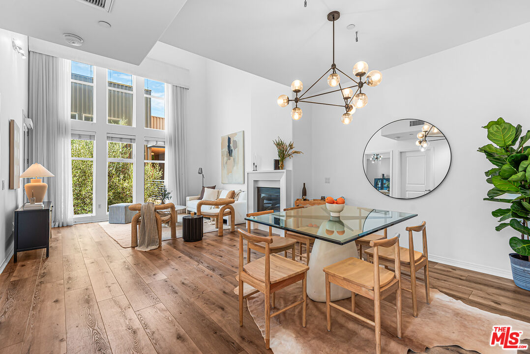 4050 Glencoe Avenue, Unit 414 Marina del Rey, CA 90292 - Photo 8 of 31 a living room with fireplace a couch and a potted plant