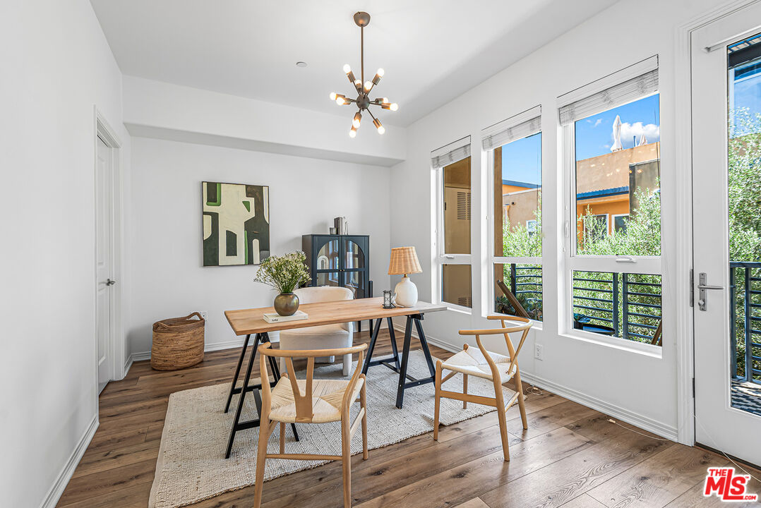 4050 Glencoe Avenue, Unit 414 Marina del Rey, CA 90292 - Photo 9 of 31 a view of a dining room with furniture window and wooden floor