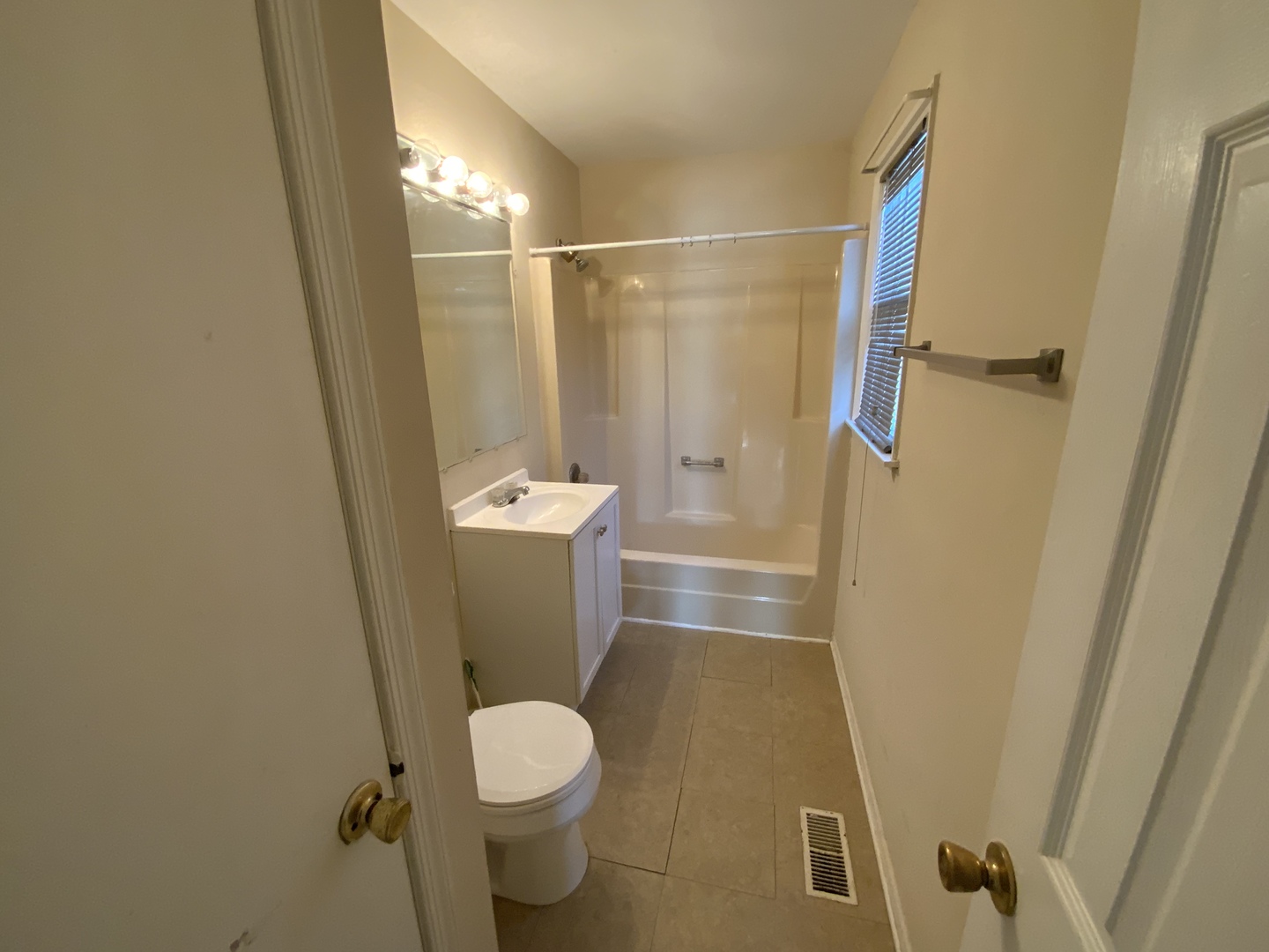 321 West Joe Orr Road Chicago Heights, IL 60411 - Photo 19 of 36 a bathroom with a toilet and a shower