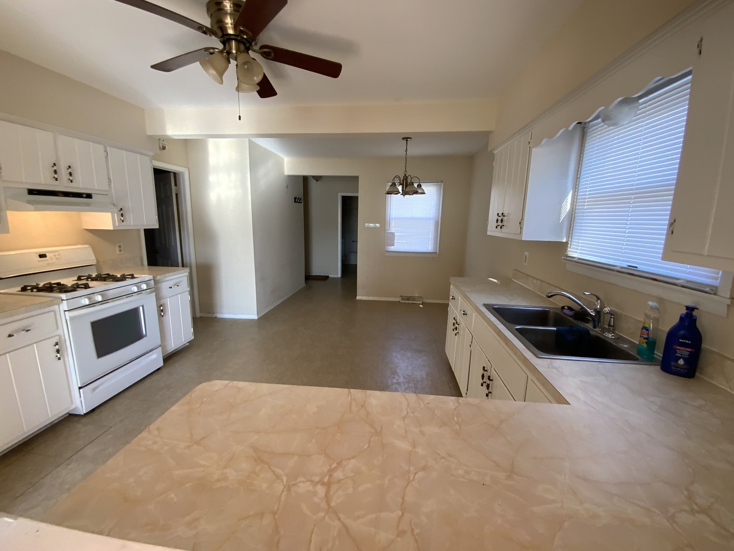321 West Joe Orr Road Chicago Heights, IL 60411 - Photo 5 of 36 a kitchen with stainless steel appliances a sink a stove and cabinets