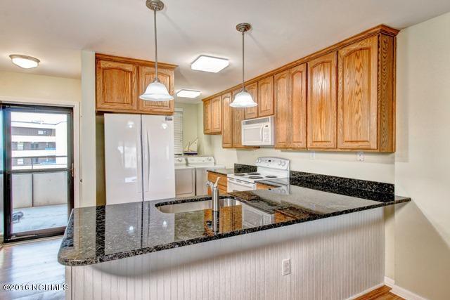 1505 Salter Path Road, Unit 508 Indian Beach, NC 28512 - Photo 2 of 15 Newly remodeled open kitchen, granite counters, new sink, faucets, pendant lighting, new French door style refrigerator