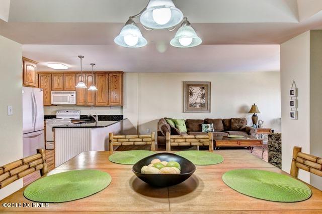 1505 Salter Path Road, Unit 508 Indian Beach, NC 28512 - Photo 7 of 15 Dining area to kitchen