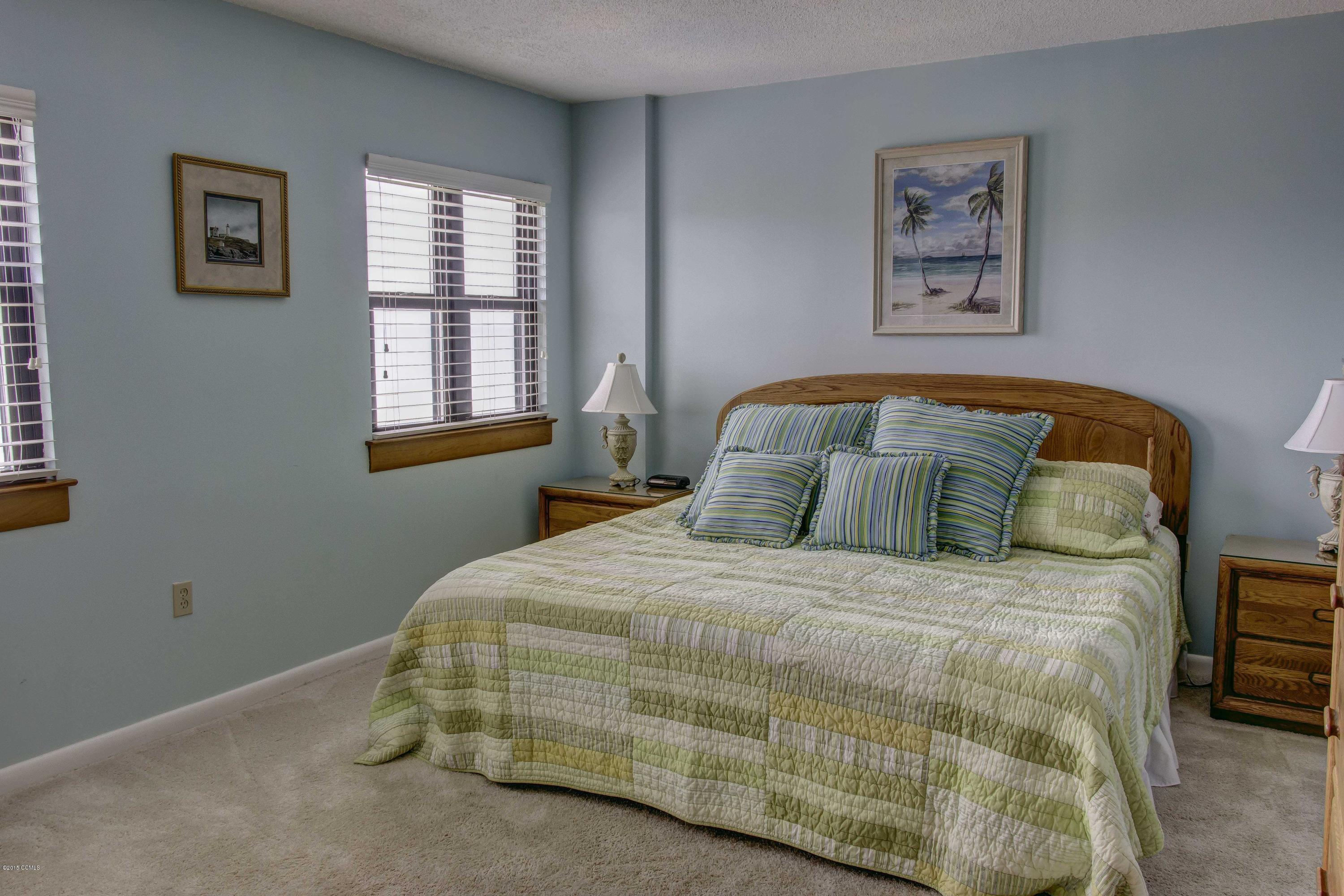 1505 Salter Path Road, Unit 508 Indian Beach, NC 28512 - Photo 9 of 15 Large master bedroom ha two closets, full bath & walk out to deck.