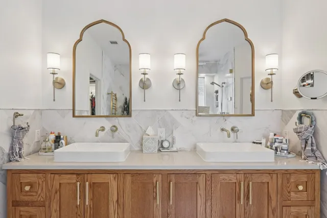 a living room with furniture a flat screen tv and a table