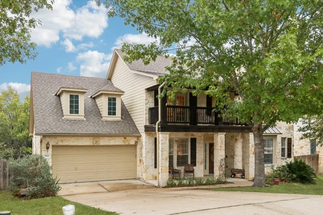 a front view of a house with outdoor seating