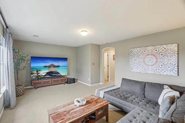 a view of a garden with sitting area