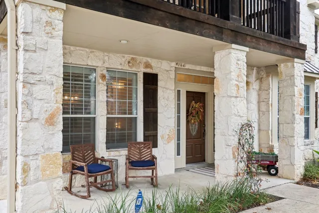 a view of living room filled with furniture and wooden floor