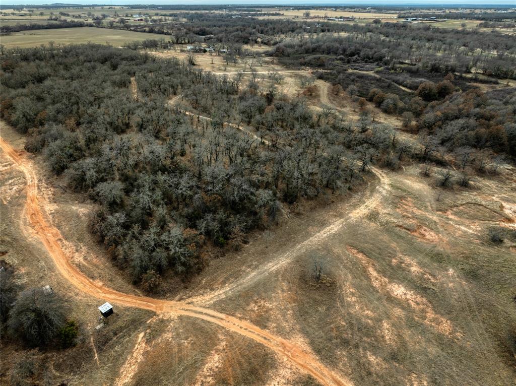 0 Turpin Lake Road Poolville, TX 76487 - Photo 15 of 18 a view of a yard with wooden fence