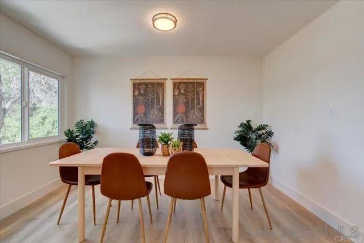 265 Wilkinson Drive San Marcos, CA 92078 - Photo 14 of 34 a view of a dining room with furniture and wooden floor