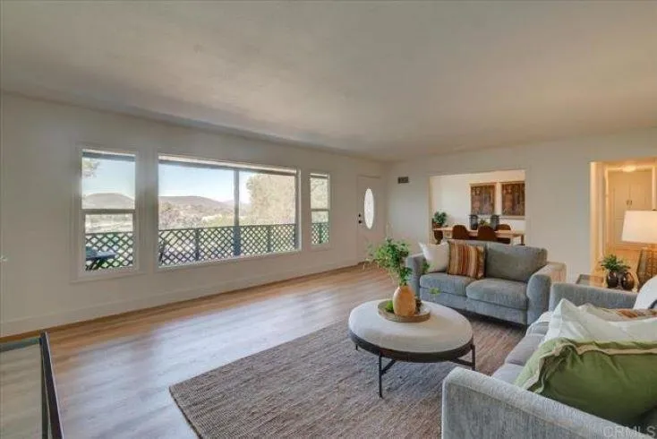 265 Wilkinson Drive San Marcos, CA 92078 - Photo 3 of 34 a living room with furniture and a large window