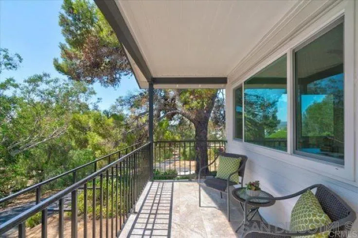265 Wilkinson Drive San Marcos, CA 92078 - Photo 5 of 34 a view of a chair and tables in the balcony