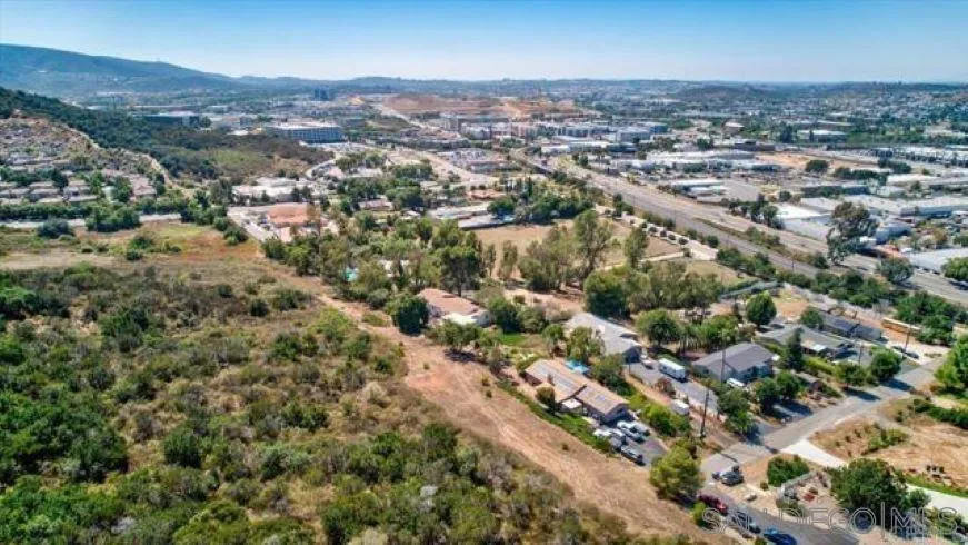 265 Wilkinson Drive San Marcos, CA 92078 - Photo 6 of 34 an aerial view of a city with lots of residential buildings