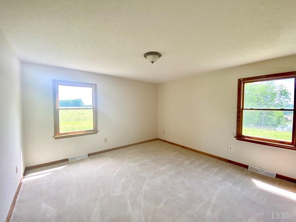 2568 Five Forks Road Pamplin, VA 23958 - Photo 11 of 22 an empty room with a window