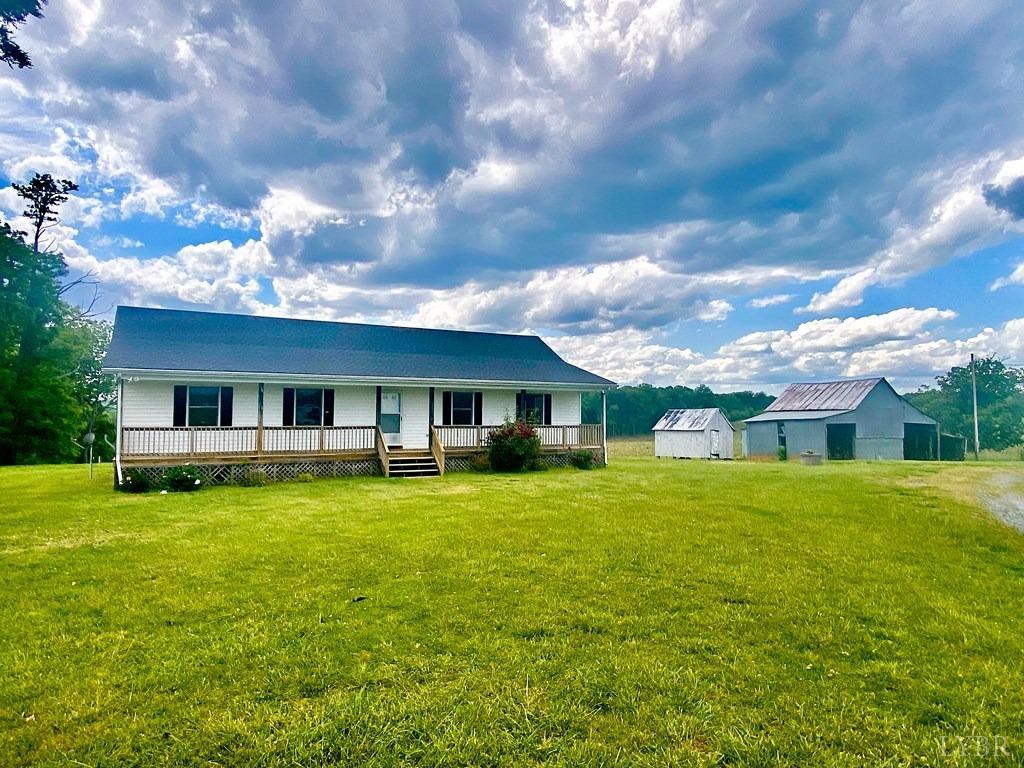 2568 Five Forks Road Pamplin, VA 23958 - Photo 22 of 22 a view of a house with a big yard and a large tree