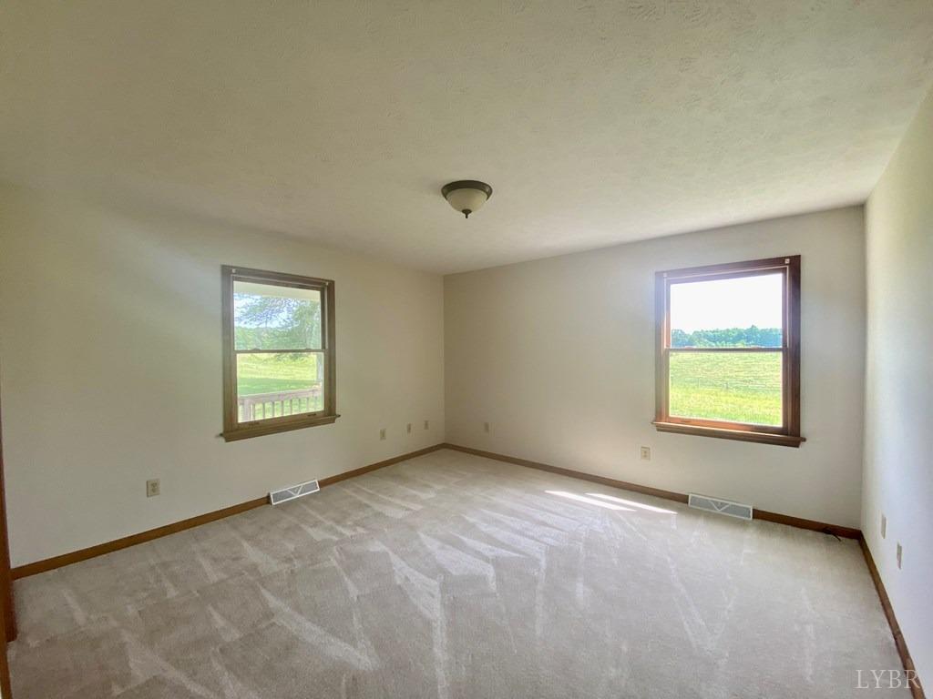 2568 Five Forks Road Pamplin, VA 23958 - Photo 8 of 22 an empty room with a window