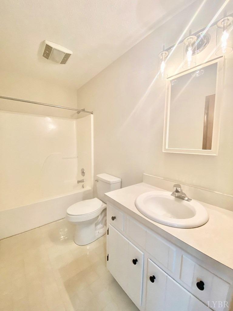 2568 Five Forks Road Pamplin, VA 23958 - Photo 10 of 22 a bathroom with a sink a toilet and shower