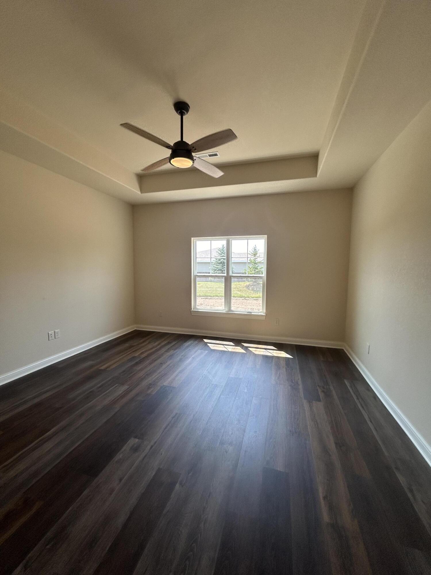 529 Fire Fly Trail, Unit 2 Hartford, WI 53027 - Photo 23 of 50 Primary BR tray ceiling