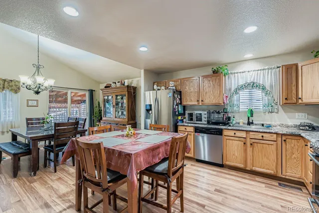 a kitchen with granite countertop lots of counter top space and dining table