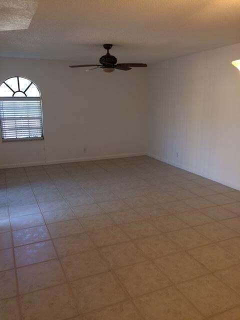 8183 Thames Boulevard, Unit B Boca Raton, FL 33433 - Photo 3 of 12 a view of an empty room with a window