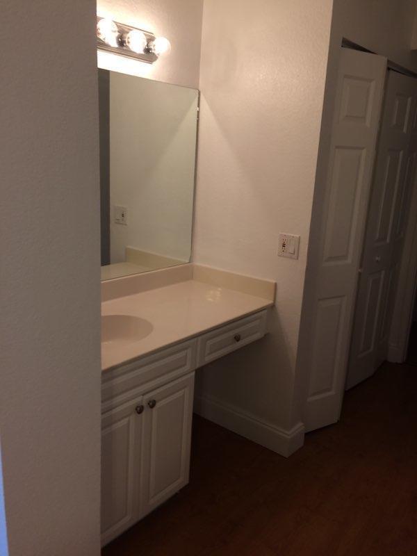 8183 Thames Boulevard, Unit B Boca Raton, FL 33433 - Photo 8 of 12 a bathroom with a sink and mirror