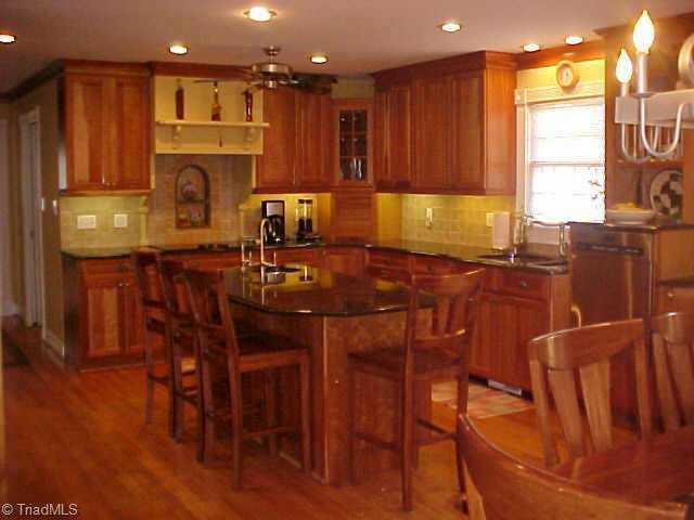 3107 St Regis Road Greensboro, NC 27408 - Photo 3 of 7 Other. Dynamite kitchen w natural cherry cabinets,vegtable sink w filtered water.Granite counters.Large island.