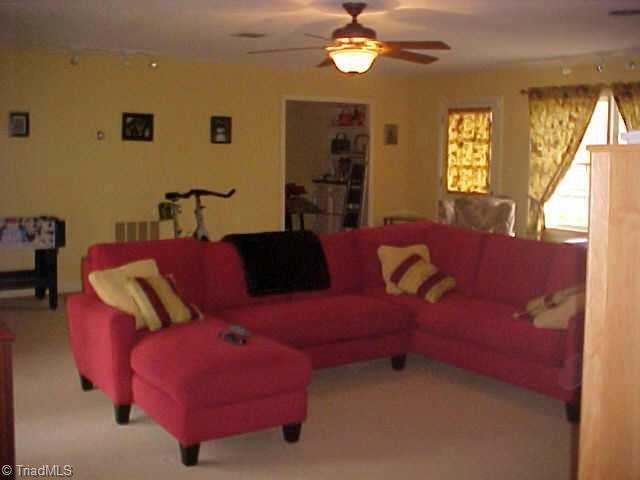 3107 St Regis Road Greensboro, NC 27408 - Photo 4 of 7 Other. Main level game room shares see thru fireplace w family room.