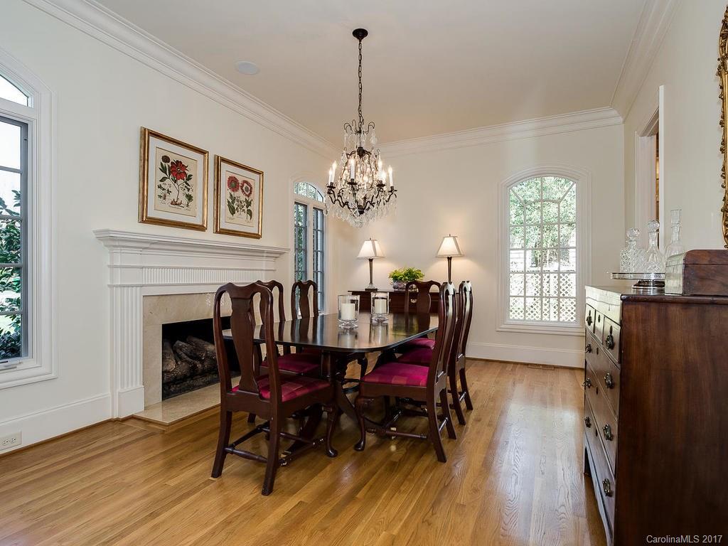 1911 Harris Road Charlotte, NC 28211 - Photo 2 of 24 a dining room with furniture a chandelier and wooden floor
