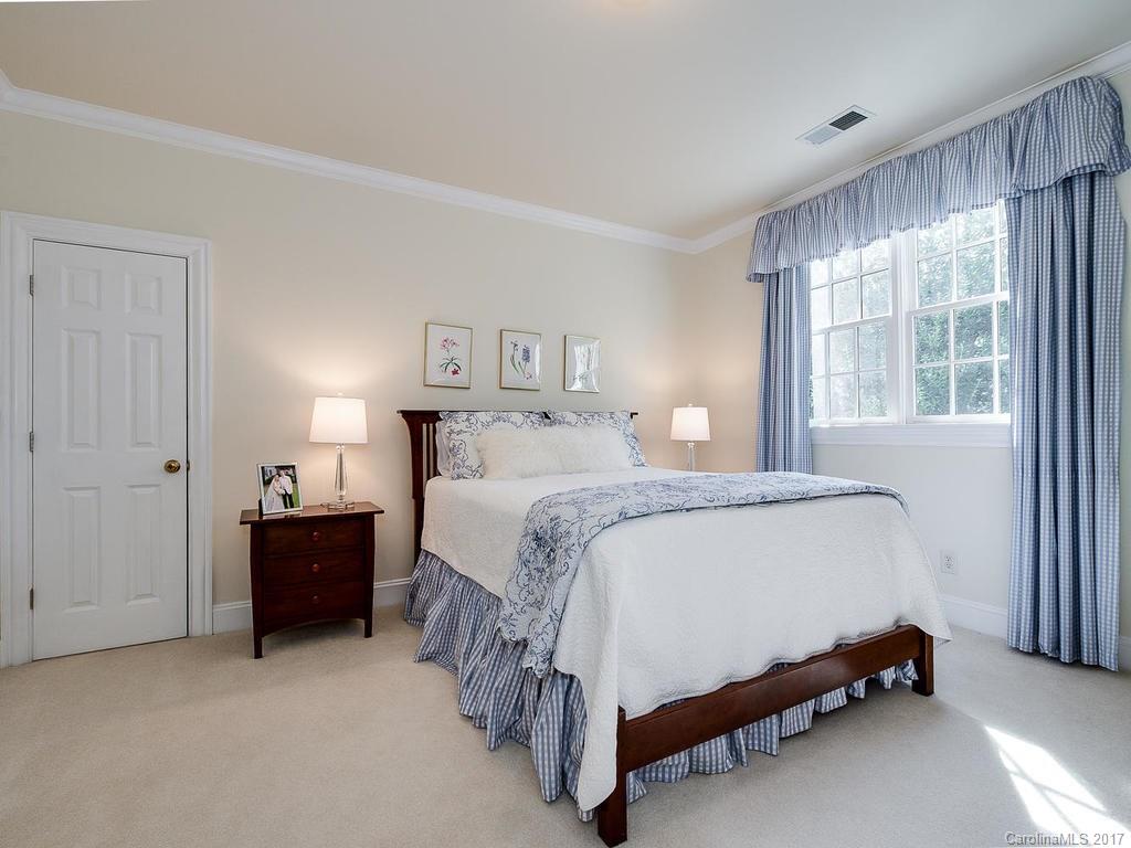 1911 Harris Road Charlotte, NC 28211 - Photo 19 of 24 a bedroom with a bed and window