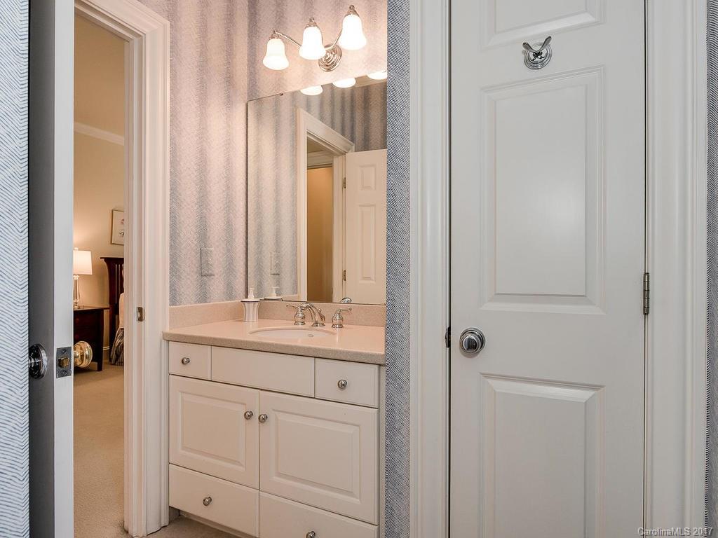 1911 Harris Road Charlotte, NC 28211 - Photo 20 of 24 a bathroom with a sink a mirror and a shower