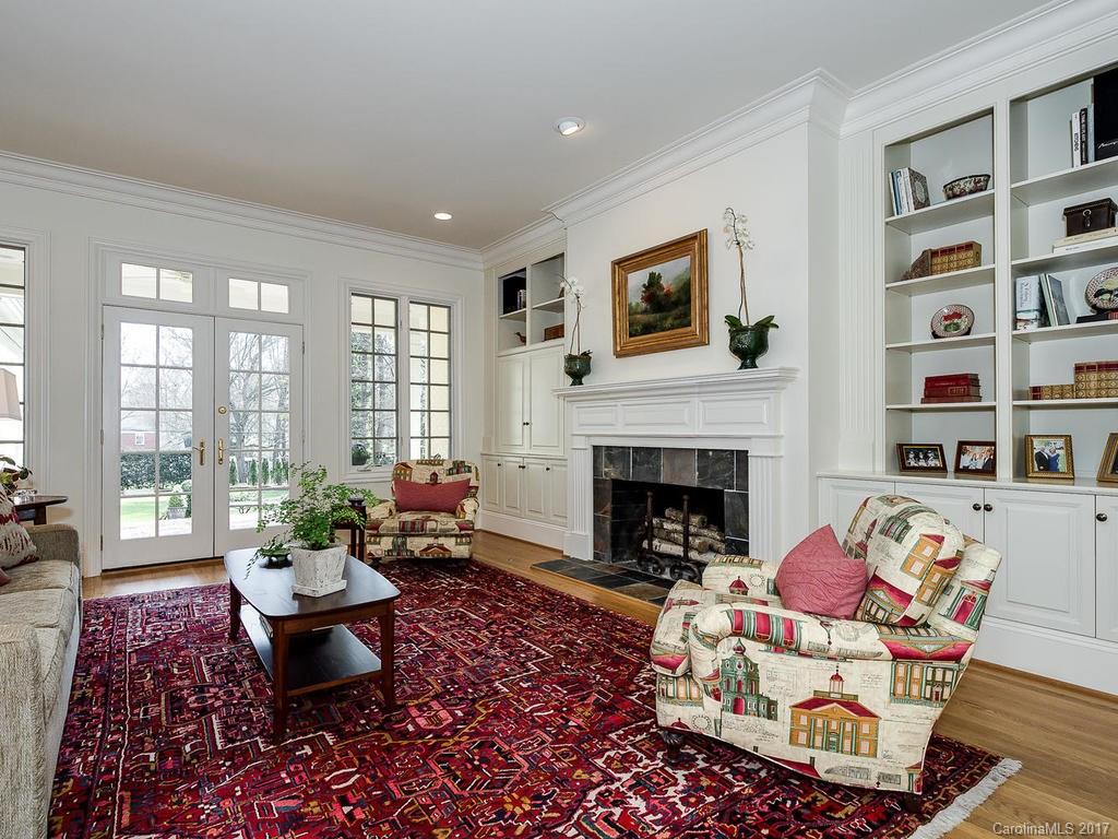 1911 Harris Road Charlotte, NC 28211 - Photo 3 of 24 a living room with furniture and a fireplace