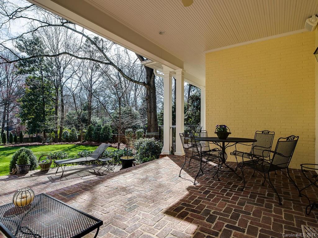 1911 Harris Road Charlotte, NC 28211 - Photo 21 of 24 a view of a patio with table and chairs and potted plants