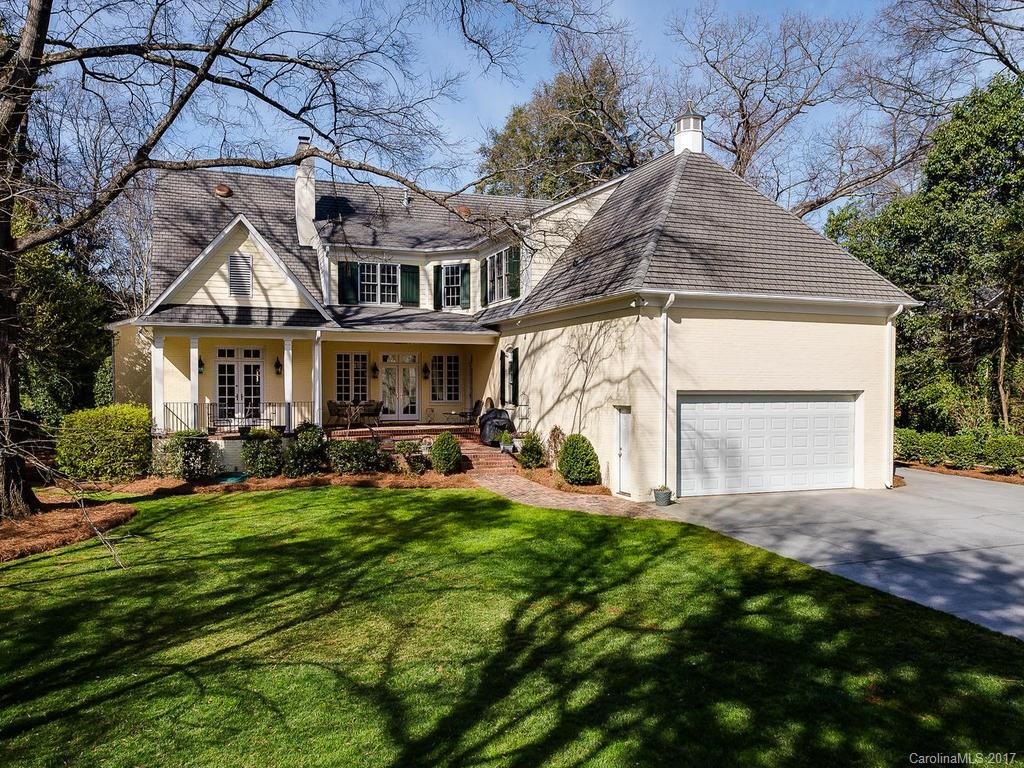 1911 Harris Road Charlotte, NC 28211 - Photo 23 of 24 a front view of a house with a yard and porch