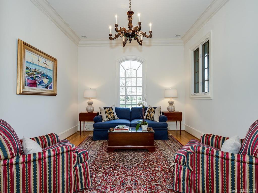 1911 Harris Road Charlotte, NC 28211 - Photo 9 of 24 a living room with furniture a chandelier and a window