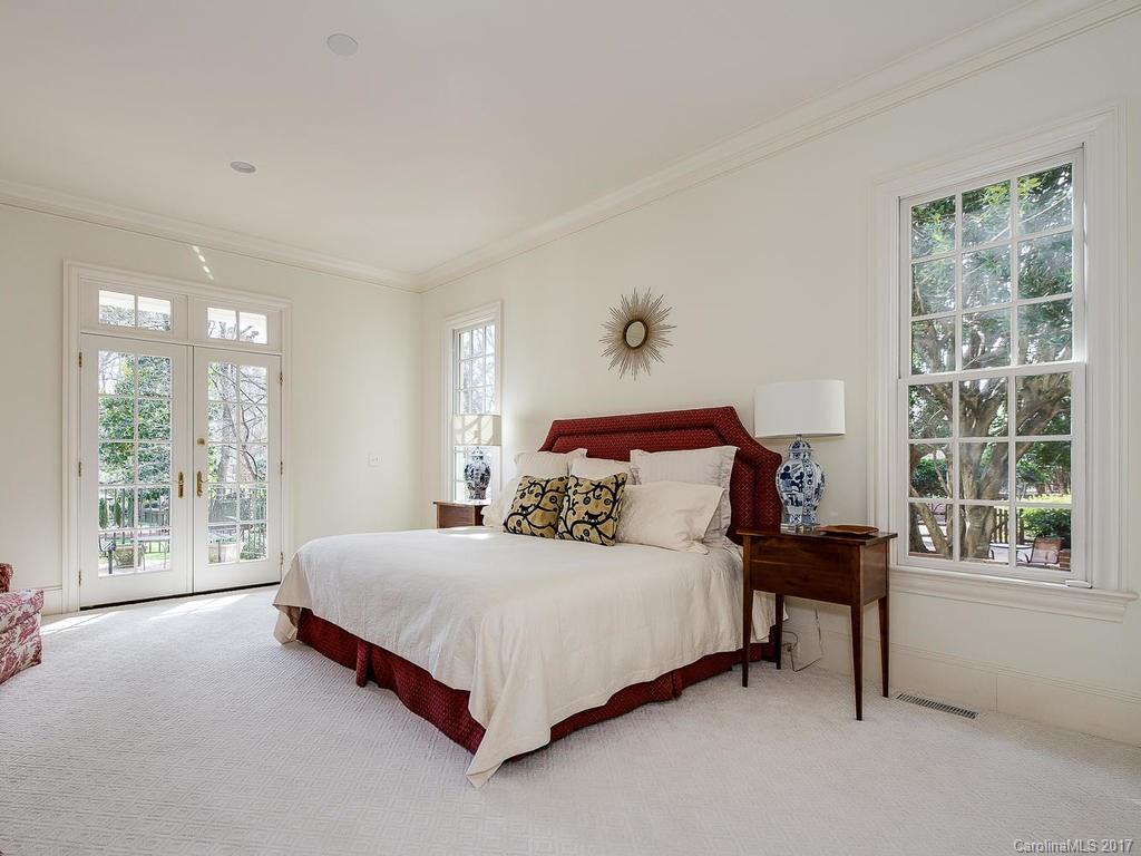 1911 Harris Road Charlotte, NC 28211 - Photo 10 of 24 a bedroom with a bed and a large window
