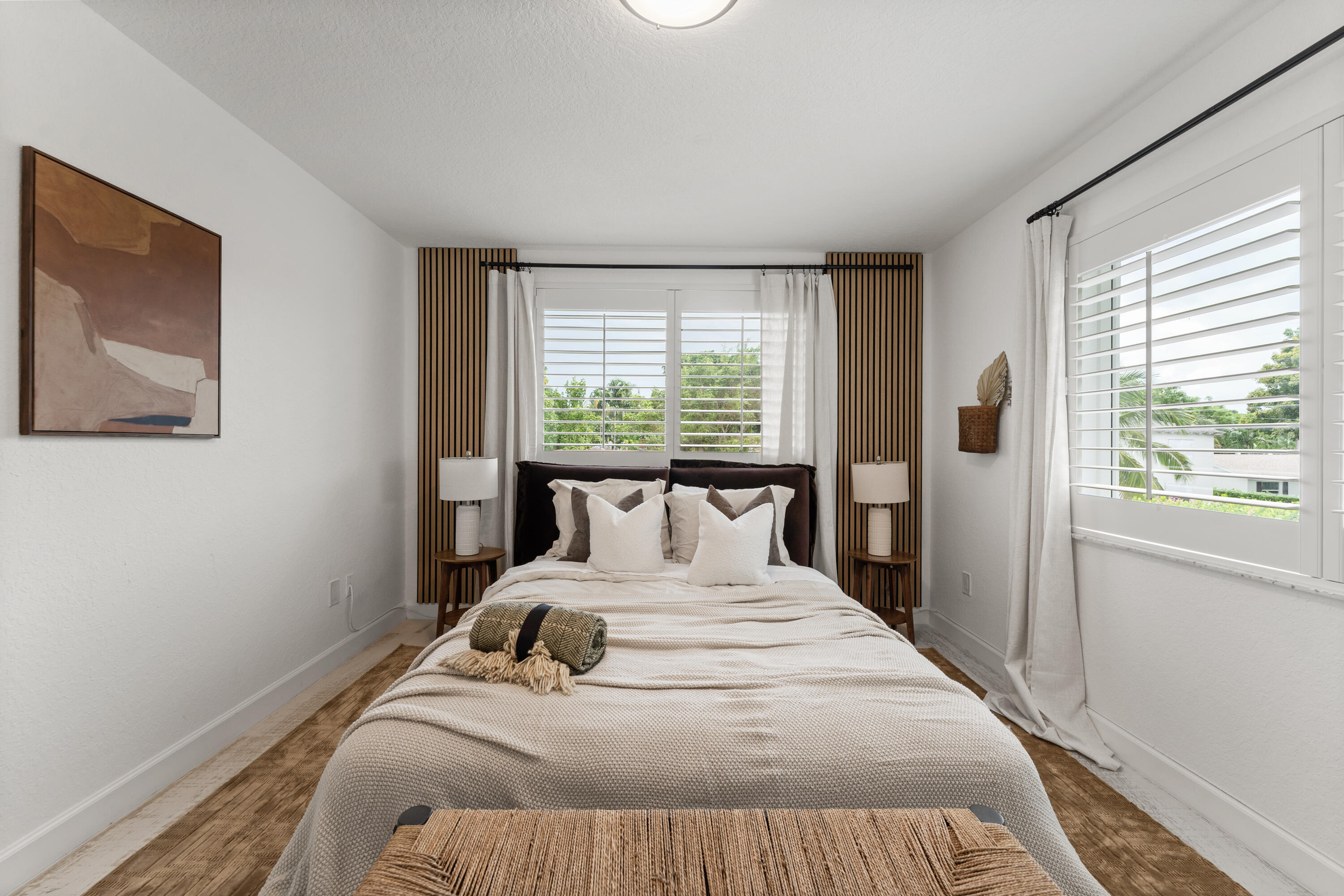 921 Ortega Road West Palm Beach, FL 33405 - Photo 18 of 60 a bedroom with a large bed and a large window