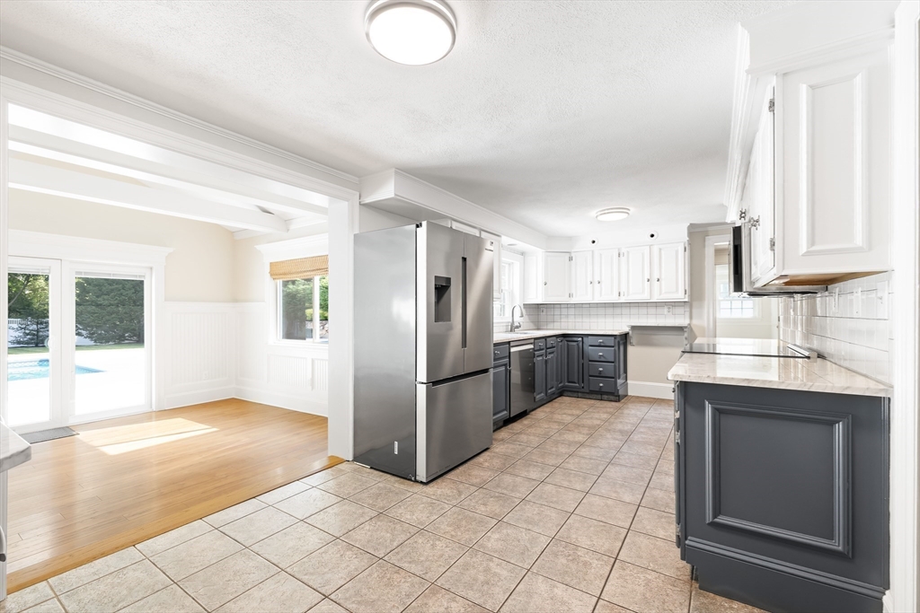 17 Appleton Road Natick, MA 01760 - Photo 13 of 42 a kitchen with a sink a counter top space and stainless steel appliances
