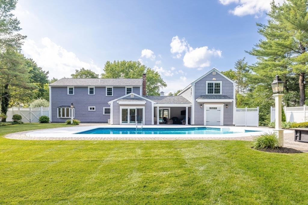 17 Appleton Road Natick, MA 01760 - Photo 2 of 42 a front view of a house with swimming pool and porch with seating space