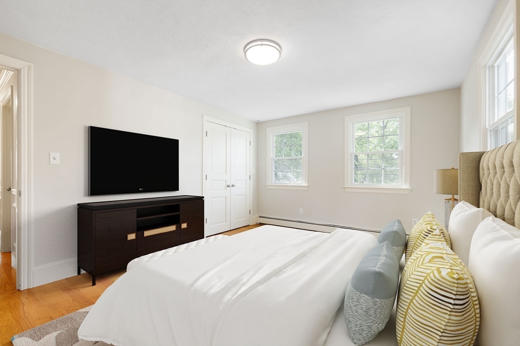 17 Appleton Road Natick, MA 01760 - Photo 25 of 42 a bedroom with a bed and a flat screen tv