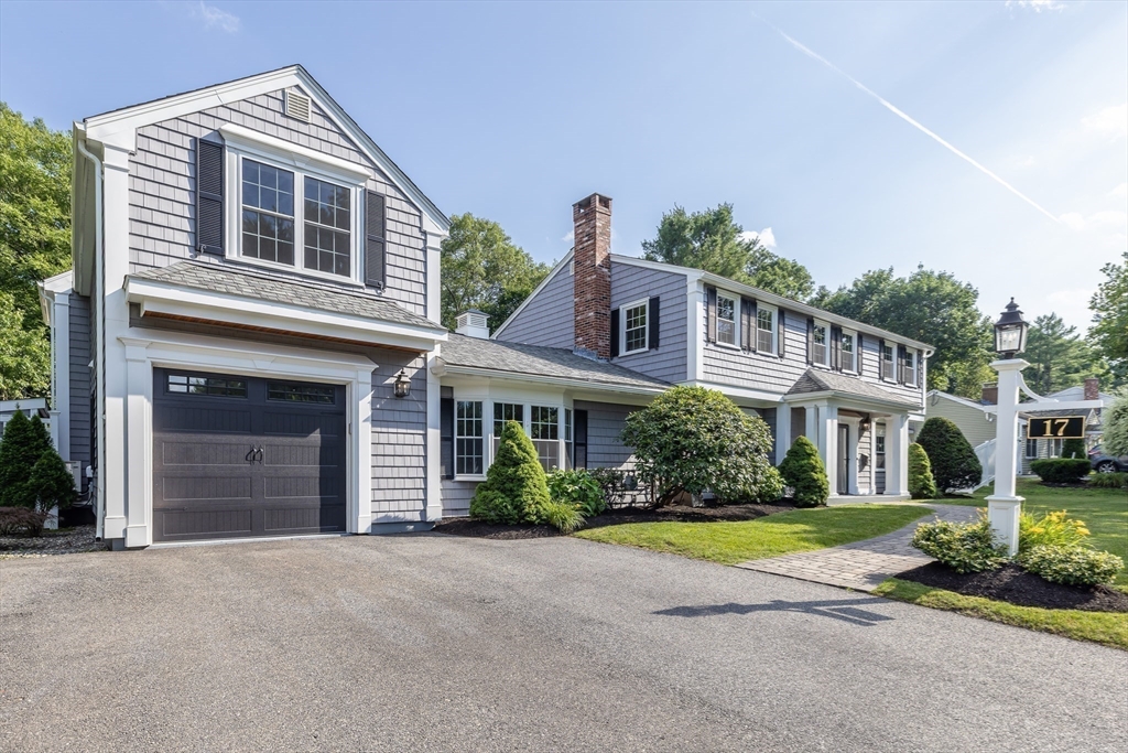 17 Appleton Road Natick, MA 01760 - Photo 6 of 42 a front view of a house with a yard and garage
