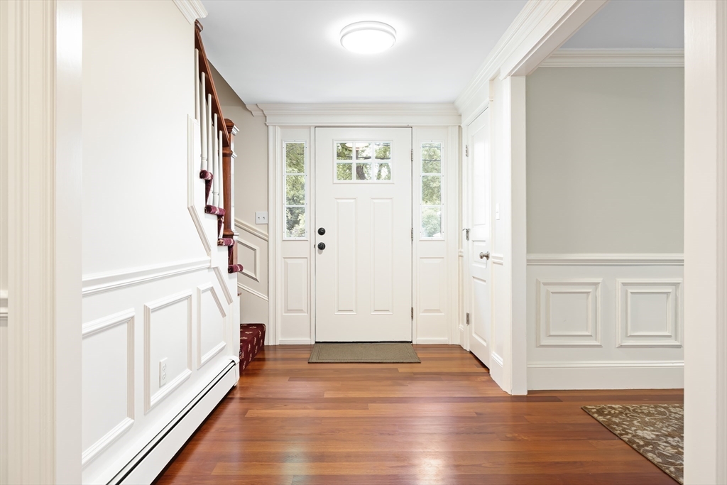 17 Appleton Road Natick, MA 01760 - Photo 7 of 42 a view of a hallway with wooden floor and entryway